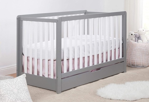 Baby crib with outlet drawers underneath