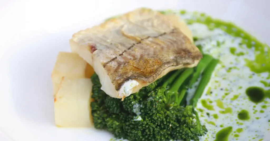 Fish and broccoli on the plate