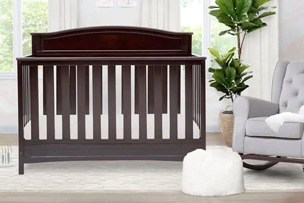 The Delta Children Emery 4-in-1 convertible crib in the nursery. The official image from the Delta Children.